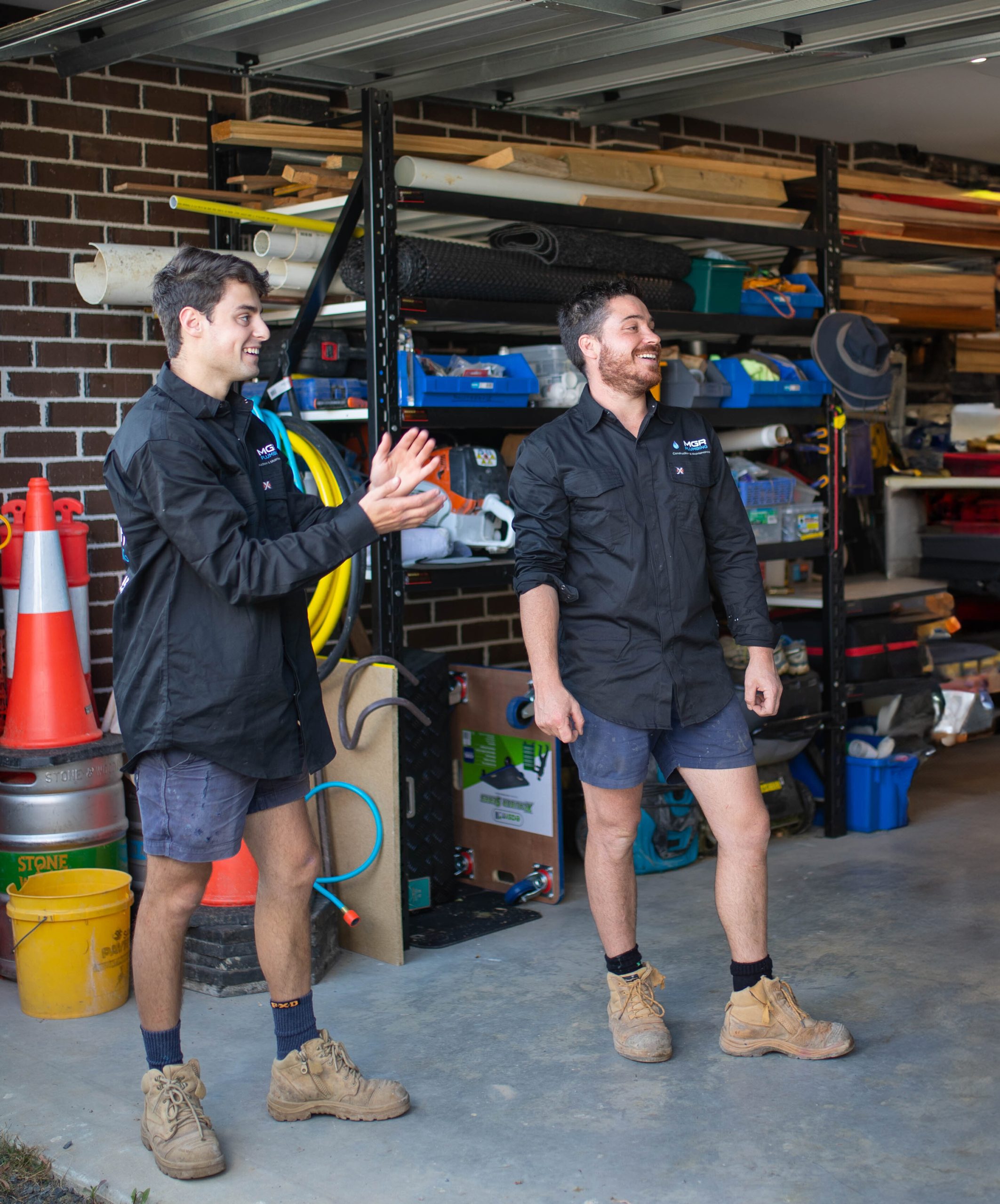 2 local plumbers in a garage